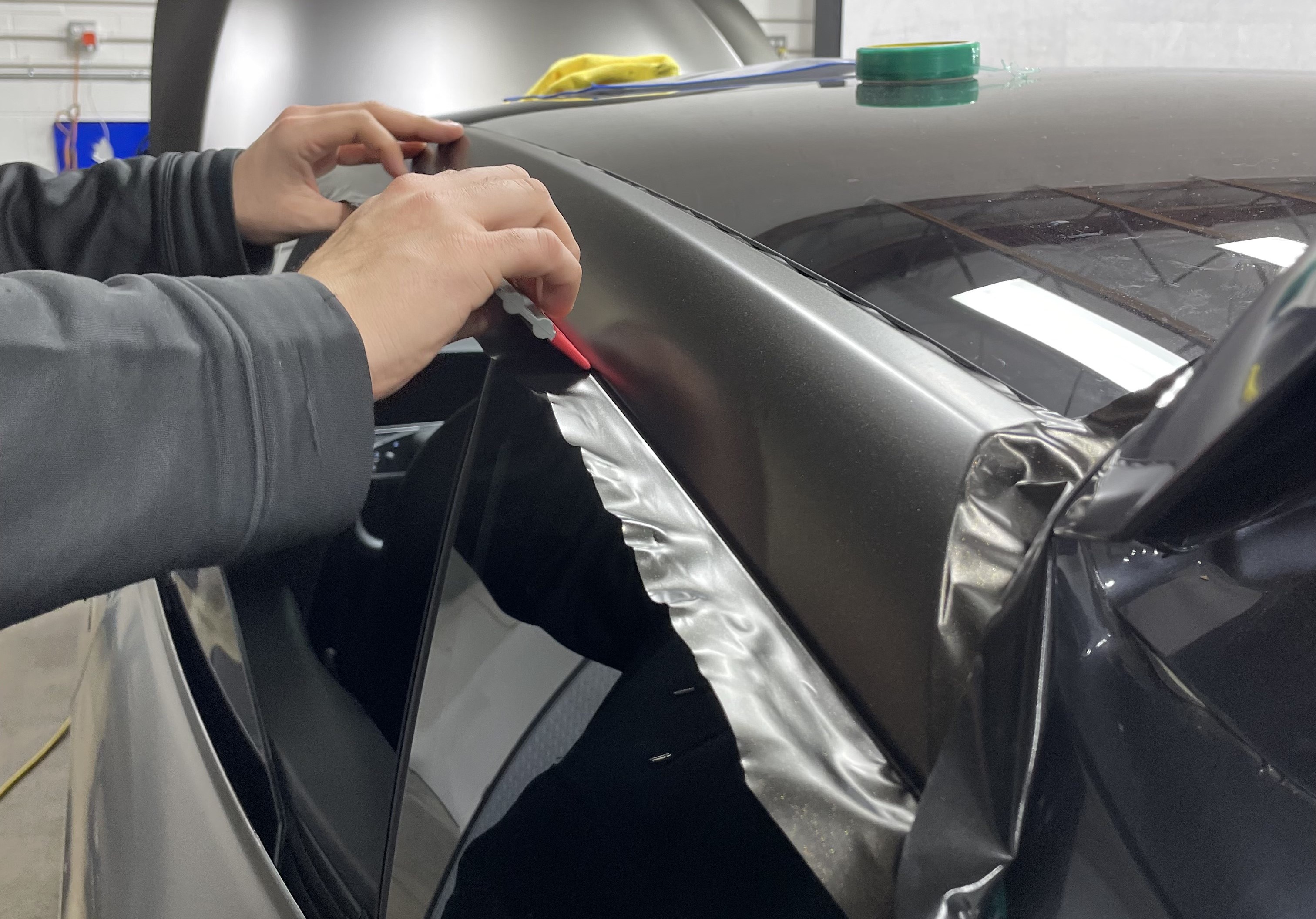 Installation process of the Satin Gold Dust Black on a Tesla Model S